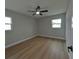Bedroom featuring a ceiling fan and two windows at 4434 Bass St, Tampa, FL 33617