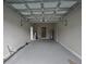 Spacious garage with a water heater, gray epoxy flooring, and an automatic garage door opener at 4434 Bass St, Tampa, FL 33617