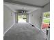 Open garage featuring gray epoxy flooring and an automatic garage door opener for convenience at 4434 Bass St, Tampa, FL 33617