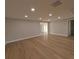 Bright, spacious living room with recessed lighting and wood-look floors at 4434 Bass St, Tampa, FL 33617