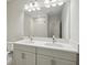 Beautifully designed bathroom with dual sinks, granite counters, vanity, and tiled shower at 4523 Foley Grove Dr, Valrico, FL 33596