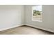 Bright bedroom featuring hardwood floors and a large window overlooking the street at 4523 Foley Grove Dr, Valrico, FL 33596