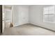Neutral bedroom features a window, double closet and carpeted floor at 4523 Foley Grove Dr, Valrico, FL 33596
