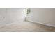 This bedroom has a plush carpet and natural light from the window at 4523 Foley Grove Dr, Valrico, FL 33596