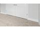 Close-up of bedroom interior with plush carpeting and full-sized closet doors at 4523 Foley Grove Dr, Valrico, FL 33596