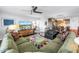 Open-concept living area features a dining area and is connected to a modern kitchen at 4651 1St Ne St # 402, St Petersburg, FL 33703