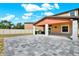 Backyard featuring a gray brick patio and a covered lanai at 5067 Sable Chime Dr, Wimauma, FL 33598