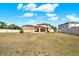 Large backyard featuring a patio, a covered lanai, and plenty of lawn space at 5067 Sable Chime Dr, Wimauma, FL 33598
