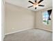 This bedroom features carpeted floors, a window, and a closet at 5067 Sable Chime Dr, Wimauma, FL 33598