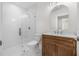 Modern bathroom boasts a frameless glass shower, lovely vanity, and designer fixtures at 526 62Nd Ne Ave, St Petersburg, FL 33702