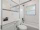 Bathroom featuring white subway tile, dark fixtures, and a shower-tub combination for a modern look at 526 62Nd Ne Ave, St Petersburg, FL 33702