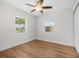 Bright bedroom featuring hardwood floors, windows, and a ceiling fan for a comfortable atmosphere at 526 62Nd Ne Ave, St Petersburg, FL 33702