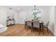 Dining area with a modern table and chairs, adjacent to a bright window at 526 62Nd Ne Ave, St Petersburg, FL 33702