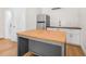 Charming kitchen features a functional island, modern appliances, and bright subway tile backsplash at 526 62Nd Ne Ave, St Petersburg, FL 33702