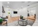 Open-concept living room boasting sleek flooring, stylish decor, and recessed lighting at 526 62Nd Ne Ave, St Petersburg, FL 33702