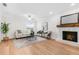 Cozy living room featuring a stone fireplace, neutral decor, and recessed lighting at 526 62Nd Ne Ave, St Petersburg, FL 33702
