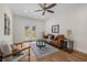 A bright living room featuring stylish furniture, hardwood floors, and a view of the backyard at 526 62Nd Ne Ave, St Petersburg, FL 33702