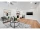 Spacious living room featuring a stone fireplace, modern decor, and recessed lighting at 526 62Nd Ne Ave, St Petersburg, FL 33702
