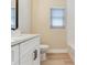 Bathroom with white vanity, modern fixtures, and subway tile at 5470 Bayshore Dr, Seminole, FL 33772