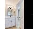 Well-lit bathroom featuring a vanity, and a view into the adjacent room at 5470 Bayshore Dr, Seminole, FL 33772
