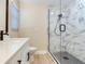 Bathroom featuring marble tile shower and modern fixtures at 5470 Bayshore Dr, Seminole, FL 33772