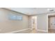 Spacious bedroom with a window and access to the bathroom at 5470 Bayshore Dr, Seminole, FL 33772