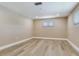 A neutral colored bedroom with recessed lighting and two windows at 5470 Bayshore Dr, Seminole, FL 33772