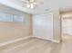 Bedroom featuring closet, light wood flooring, neutral walls, and bright window at 5470 Bayshore Dr, Seminole, FL 33772