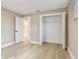 Bedroom featuring closet, light wood flooring, and neutral walls at 5470 Bayshore Dr, Seminole, FL 33772