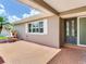 Charming front porch with patterned tile, providing an inviting entrance to the home at 5470 Bayshore Dr, Seminole, FL 33772