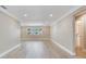 Bright living room featuring large windows and light wood flooring at 5470 Bayshore Dr, Seminole, FL 33772