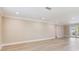 Large living room with bright walls and wood flooring at 5470 Bayshore Dr, Seminole, FL 33772