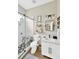 Bathroom featuring a glass shower, hexagon tile floor, white vanity and modern finishes at 5825 Terncrest Dr, Lithia, FL 33547