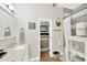 Bright bathroom featuring granite vanity, and a view into the adjacent bedroom at 5825 Terncrest Dr, Lithia, FL 33547