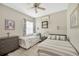 Bedroom with two twin beds, dresser, ceiling fan, and window at 5825 Terncrest Dr, Lithia, FL 33547