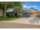 Charming home with stone accents, well-manicured lawn, mature trees, and inviting curb appeal at 5825 Terncrest Dr, Lithia, FL 33547