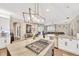 Bright, open kitchen with a gas cooktop island and seamless flow to the living area at 5825 Terncrest Dr, Lithia, FL 33547