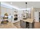 Modern kitchen featuring white cabinetry, stainless steel appliances, and a stylish island at 5825 Terncrest Dr, Lithia, FL 33547
