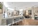 Open concept kitchen features a spacious island, breakfast bar, and adjacent dining area at 5825 Terncrest Dr, Lithia, FL 33547