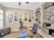 Cozy home office with custom desk, built-in bookshelves, and natural light from shuttered windows at 5825 Terncrest Dr, Lithia, FL 33547