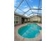 The sparkling screened pool features a brick patio, creating an ideal space for swimming and outdoor entertainment at 5825 Terncrest Dr, Lithia, FL 33547