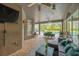 This cozy outdoor living space features brick flooring, comfortable seating, and a great view of the sparkling pool at 5825 Terncrest Dr, Lithia, FL 33547