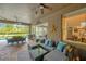 Relax on the covered porch with a comfortable seating area and views of the swimming pool at 5825 Terncrest Dr, Lithia, FL 33547