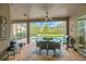 Outdoor oasis featuring a covered porch, dining area, and views of the sparkling swimming pool at 5825 Terncrest Dr, Lithia, FL 33547