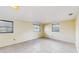Bright bedroom with tile floors and three windows at 6009 Wilshire Dr, Tampa, FL 33615