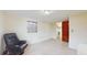 Bedroom featuring a tile floor, window, closet, and a black reclining chair at 6009 Wilshire Dr, Tampa, FL 33615