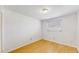 Neutral colored bedroom featuring light hardwood floors and a window at 6009 Wilshire Dr, Tampa, FL 33615