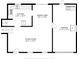 Main level floor plan with kitchen, living, dining, and garage at 6009 Wilshire Dr, Tampa, FL 33615