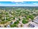 Expansive aerial view of a residential neighborhood with lush trees and scenic lakes throughout the area at 6020 N 50Th St, Tampa, FL 33610