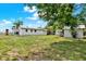 Expansive backyard with mature trees and two storage sheds at 6020 N 50Th St, Tampa, FL 33610